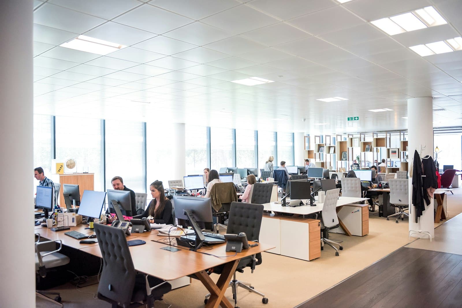 An open-plan recruitment floor with rows of staffed desks